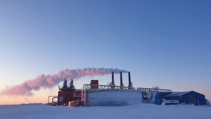 Arctic facility with steam at sunrise